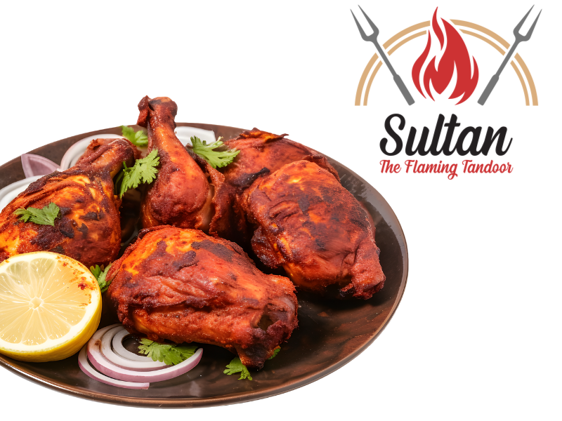 Delicious chicken tikka being cooked in a tandoor oven